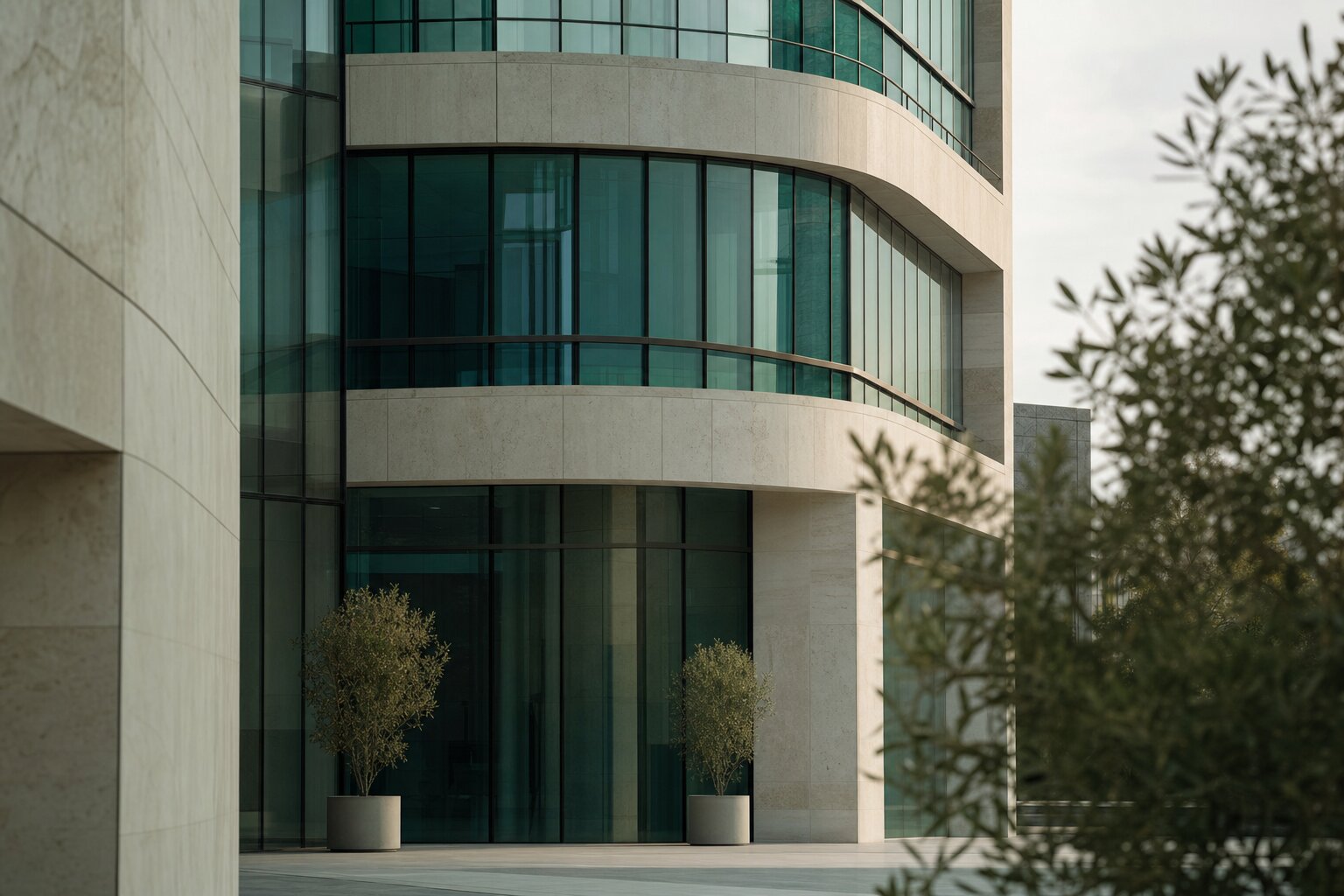 Contemporary commercial building with a teal glass facade