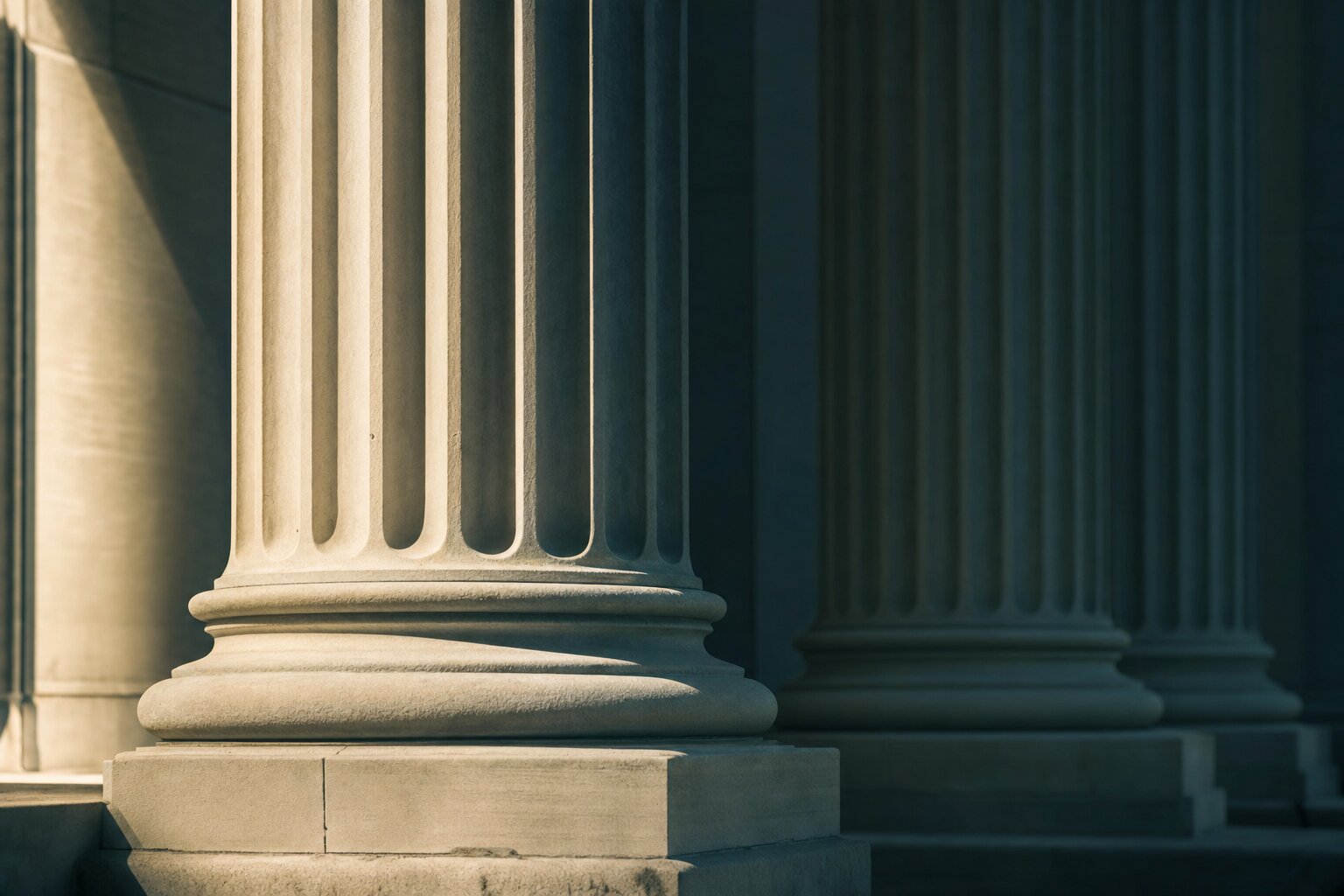 Classical courthouse columns in soft directional light